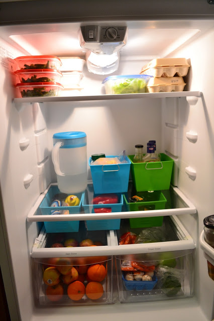 Use cheap dollar store bins to organize your fridge