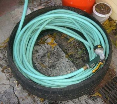 make a hose caddy out of an old tire