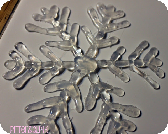 use hot glue to make snowflake ornaments