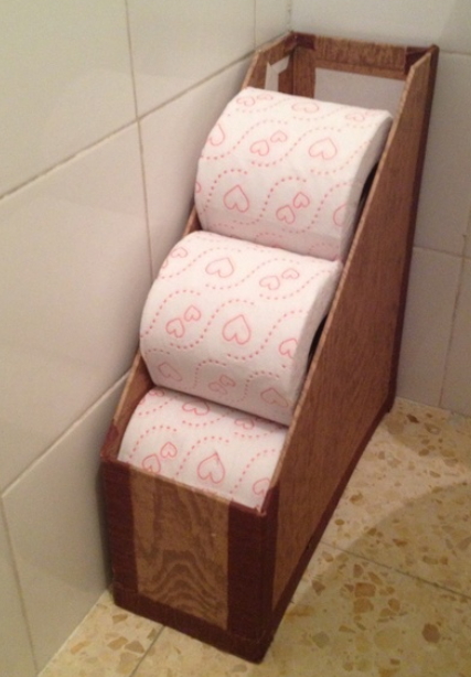 A big magazine holder can be used to store a good amount of spare toilet paper rolls