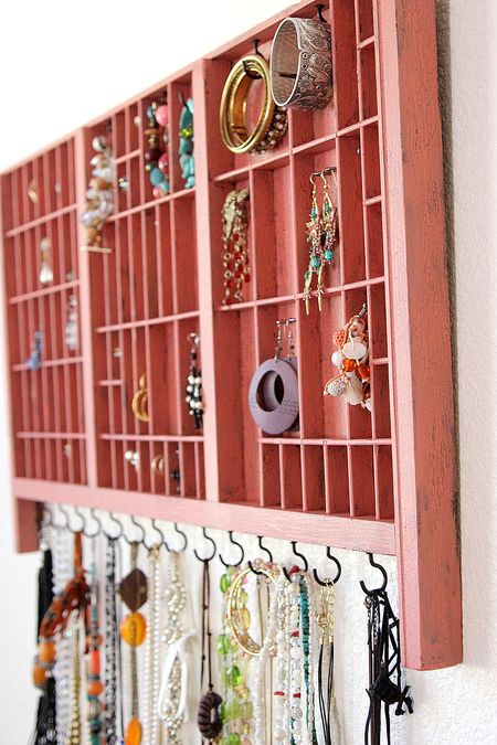 A type set tray re-purposed into a jewelry organizer
