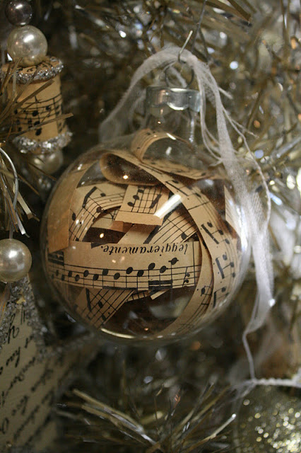 Fill empty glass ball ornaments with vintage sheet music