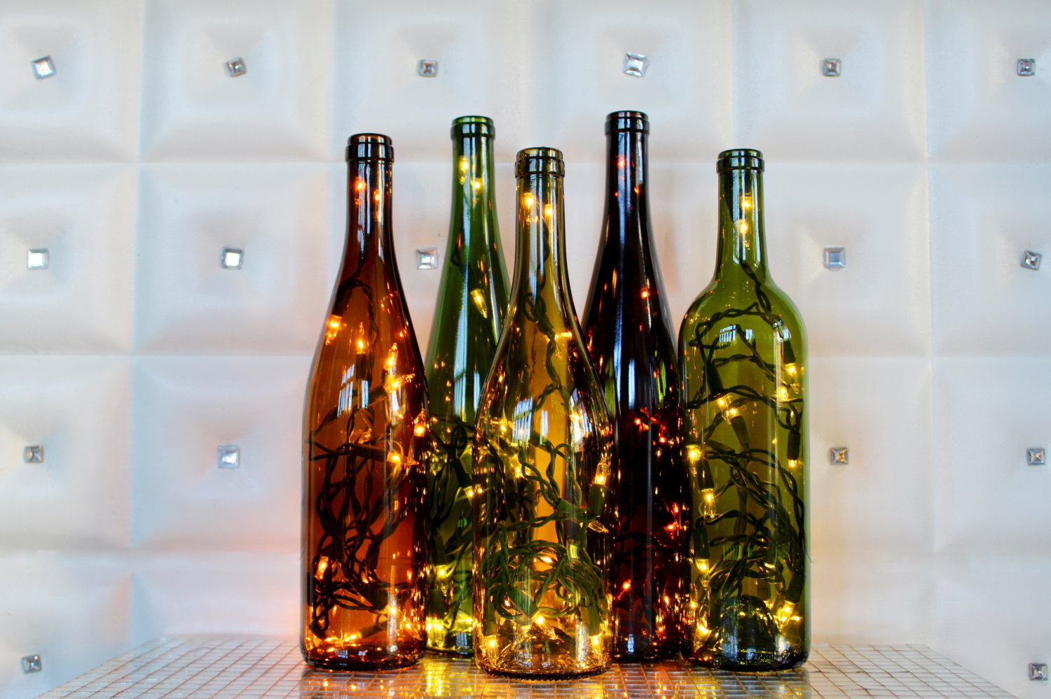 Fill wine bottles with lights to make a spectacular centerpiece