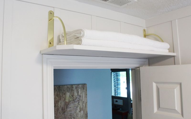 Install a shelf above the door