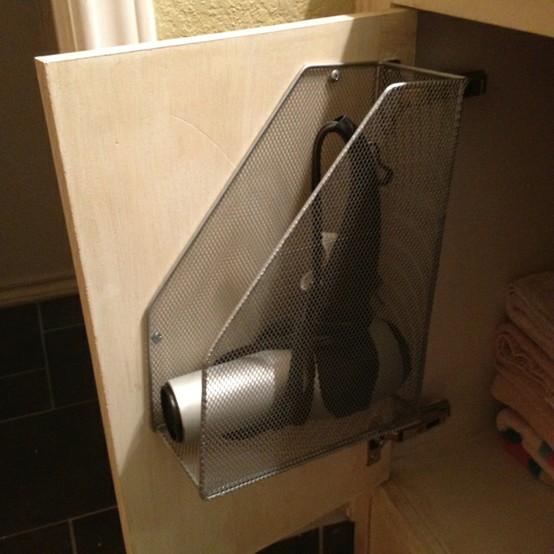 Save countertop space by attaching a magazine holder to the inside of your bathroom cabinet doors