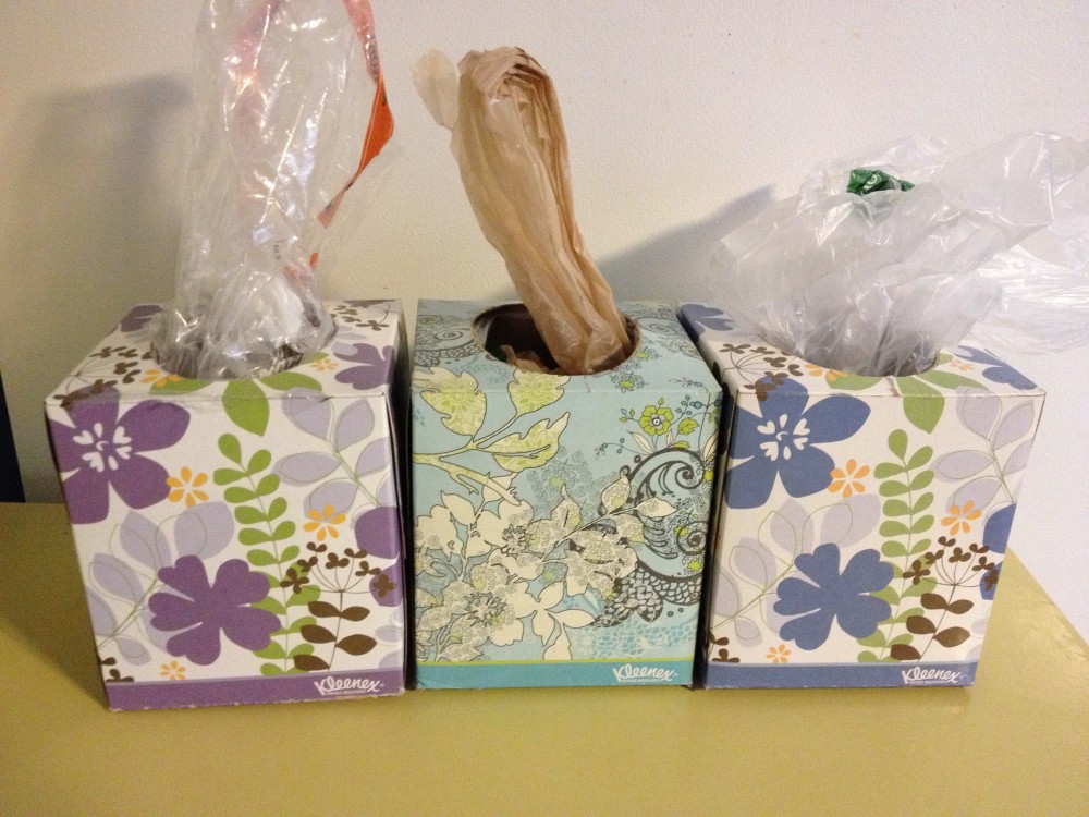 use a tissue box to easily store and dispense plastic grocery bag